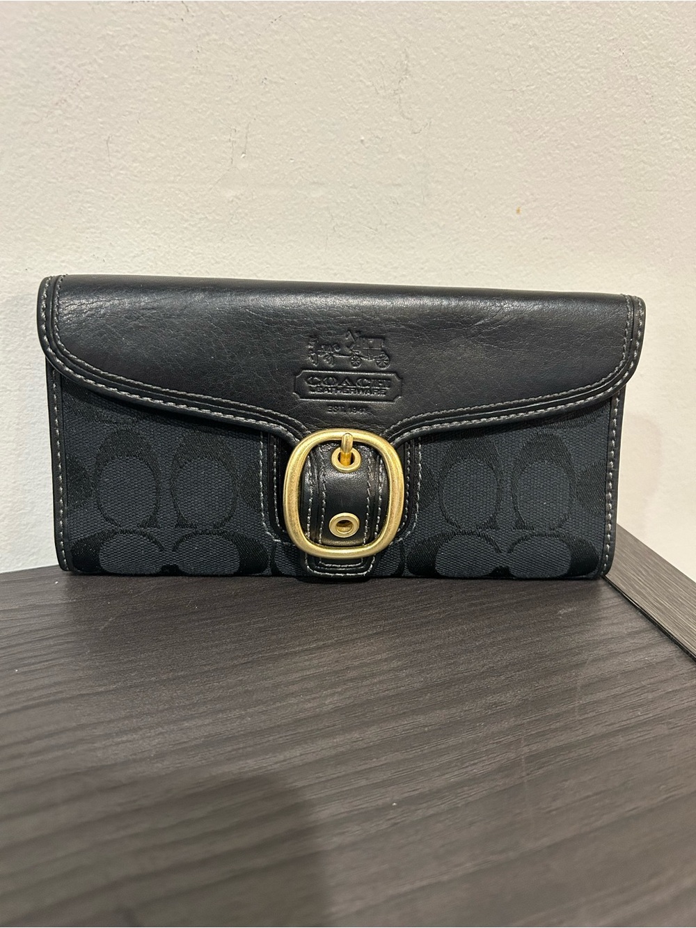 Coach Bleecker wallet light blue leather interior and a plaid tattersall lining.